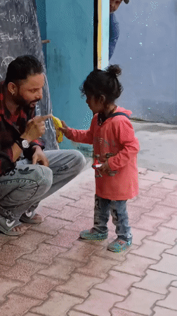 Coffee and playtime on a Vashisht walkway