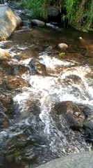 Morning at a rocky river campsite in Sajen, Indonesia