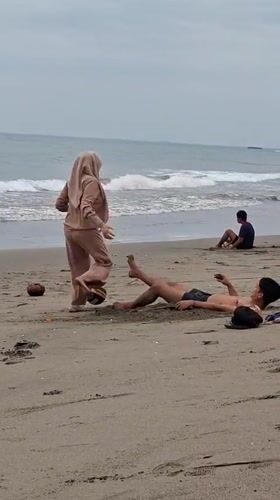Laid-back beach day in Lhokseumawe with volleyball and ocean wading