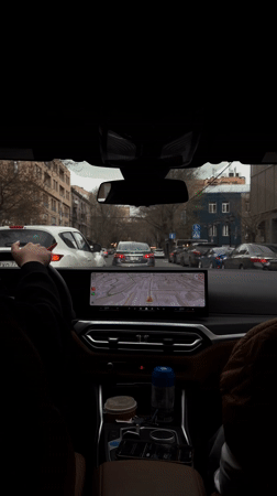 Driver uses GPS navigation system on Yerevan city streets