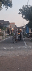 Morning street life and local commerce in Desa Sindon, Indonesia