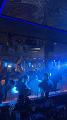 Sofia nightclub captures evening entertainment scene with performers, patrons