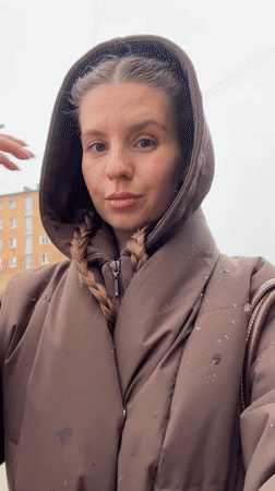 Woman documents makeup routine, outdoor content in Klin, Russia