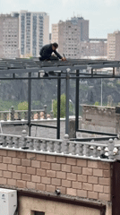 Rooftop welding work observed in Yerevan Armenia morning