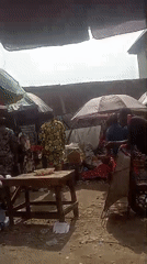 Busy outdoor marketplace documented in Umuahia, Nigeria Saturday afternoon