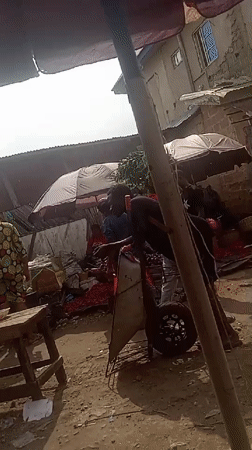 Busy outdoor marketplace documented in Umuahia, Nigeria Saturday afternoon