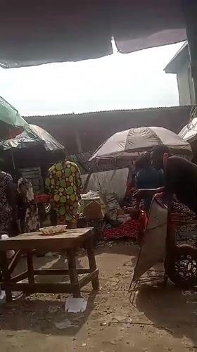 Busy outdoor marketplace documented in Umuahia, Nigeria Saturday afternoon