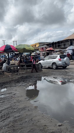 Lagos street market bustles despite muddy conditions