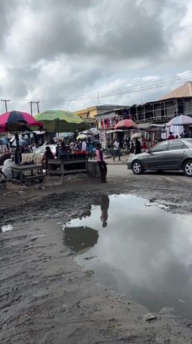 Lagos street market bustles despite muddy conditions