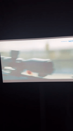 TV screen shows film scene in Braunstone Town