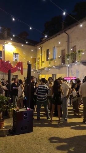 YOOX-branded outdoor evening event in Milan with live brass band