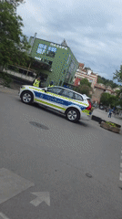 Police car parked outside market in Blagoevgrad, Bulgaria