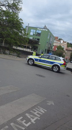 Police car parked outside market in Blagoevgrad, Bulgaria