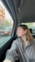 Woman observed as passenger in moving car in Perm