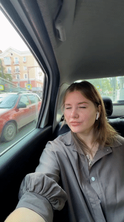Woman observed as passenger in moving car in Perm
