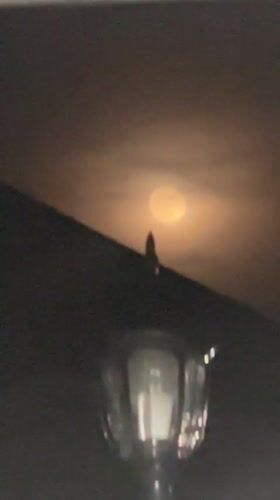 Hazy moon observed through clouds in Gyumri, Armenia