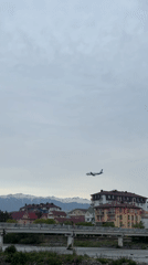 Commercial aircraft approaches Sochi Airport over residential area