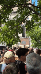 Large crowd gathers in Budapest square watching speech