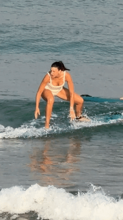 Surf session and beach activity on a Tel Aviv morning