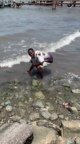 People gather at Ikorodu waterfront for casual shoreline activities