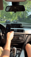 Driver uses smartphone while driving BMW in Belgrade suburb
