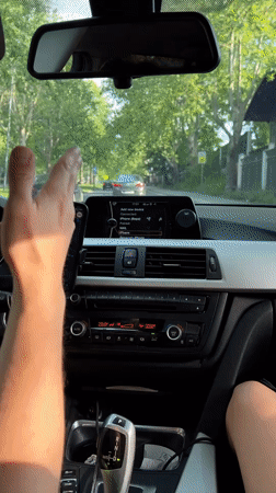 Driver uses smartphone while driving BMW in Belgrade suburb