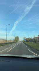 Morning traffic captured on sunny road in Veghel