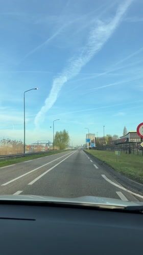 Morning traffic captured on sunny road in Veghel