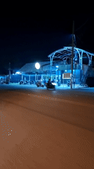 Nighttime street scene captured in Lhokseumawe, Indonesia