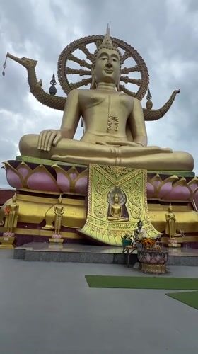 Tourist rings temple bells at Big Buddha Thailand