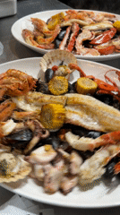 Chef prepares seafood platters in Saint Julian's commercial kitchen