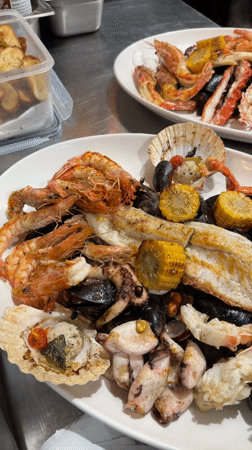Chef prepares seafood platters in Saint Julian's commercial kitchen