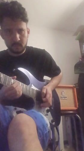 Late-night guitar performance captured in Pueblo Libre, Peru
