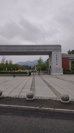 Street sweeper stops on campus crosswalk in Chongqing