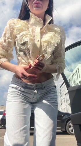 Woman photographed by car in Voronezh parking lot