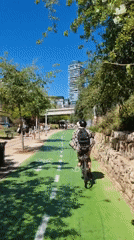 Cyclist uses marked bike path in Tel Aviv