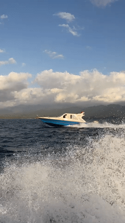 Speedboat crossing open water off the Indonesian coast