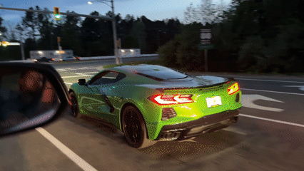 Green Corvette accelerates from stoplight in Fort Belvoir