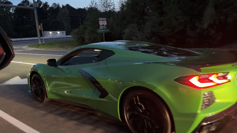 Green Corvette accelerates from stoplight in Fort Belvoir