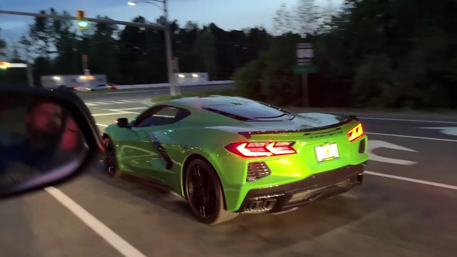 Green Corvette accelerates from stoplight in Fort Belvoir