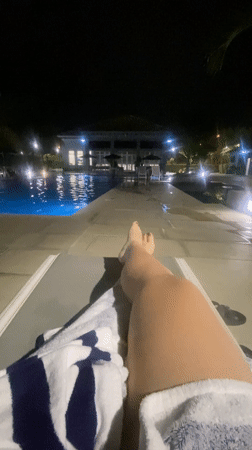 Nighttime poolside relaxation captured in Guayaquil