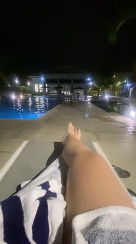 Nighttime poolside relaxation captured in Guayaquil