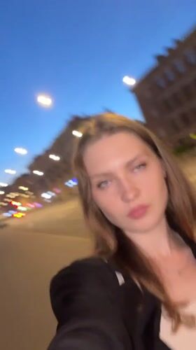 Midsummer evening stroll in Saint Petersburg, flowers in hand