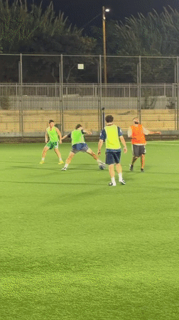 Late-night soccer on a floodlit turf pitch in Tel Aviv