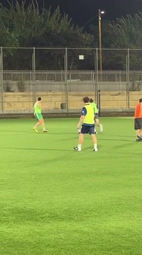 Late-night soccer on a floodlit turf pitch in Tel Aviv