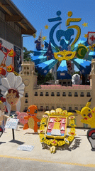 Elaborate satirical sculptures and colorful displays observed across multiple locations