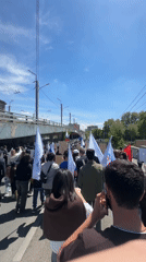 Street demonstration with flags and signs held in Yerevan