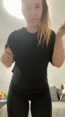 Woman dances in bedroom during early morning hours in Russia