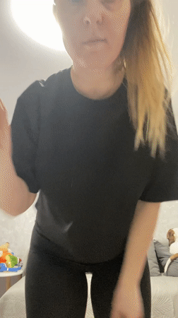 Woman dances in bedroom during early morning hours in Russia