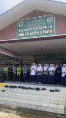 School children sing in uniforms on steps in Langnibong